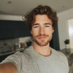 Smiling bearded man giving a weight loss testimonial after losing 31 lbs.